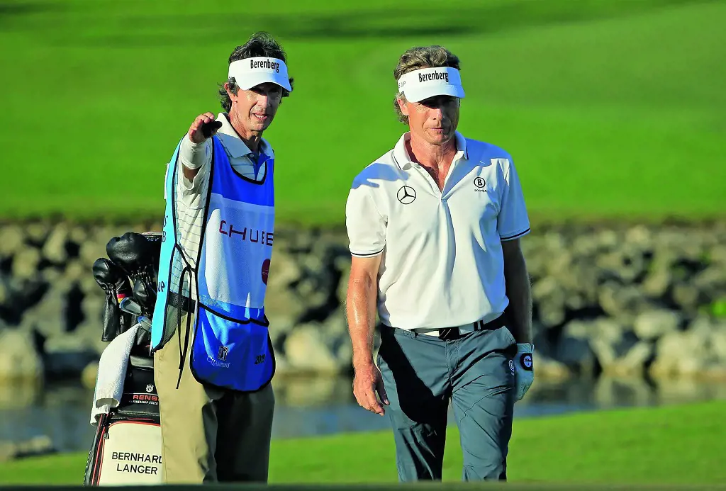 Terry Holt(left) Caddie has always been a reason for Bernhard Langer(right) as Langer Cliams.