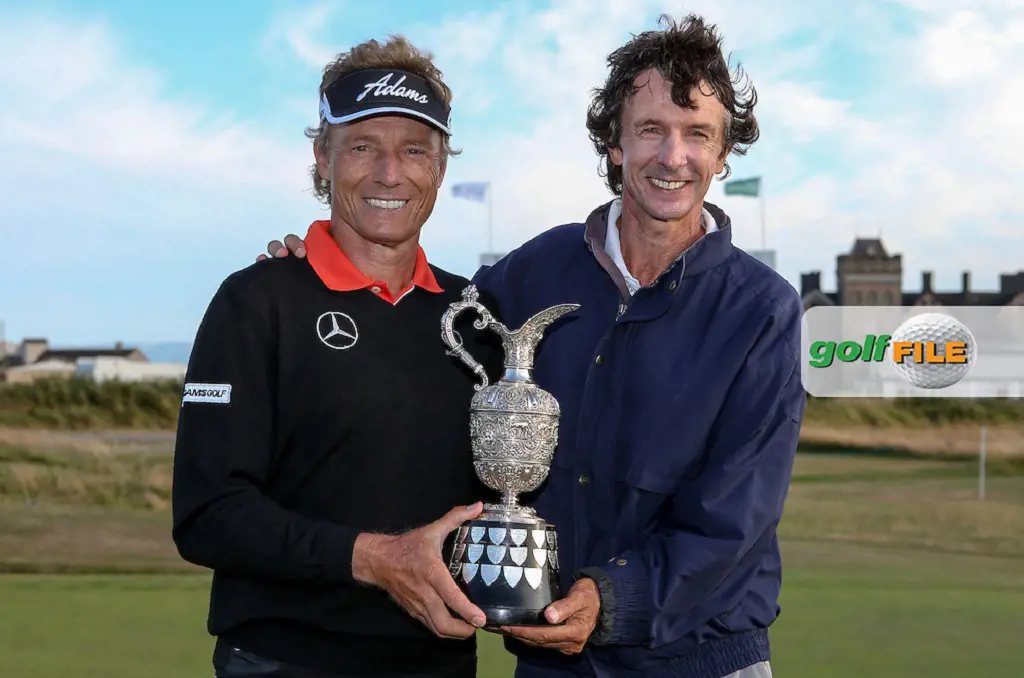 Bernhard Langer (GER) and caddie Terry Holt with the Claret Jug as they win the Final Round of the 2014 Senior Open Championship presented by Rolex from Royal Porthcawl Golf Club, Porthcawl, Wales.