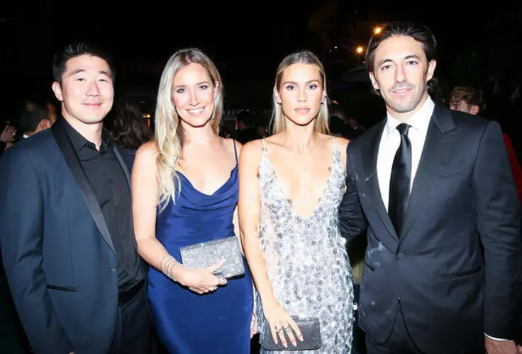 Howie and Kristine attending an award event with their friends.