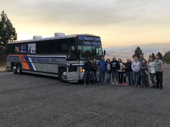 Close family and friends of the Cowboy's linebacker pose with the Vander Esch family bus 