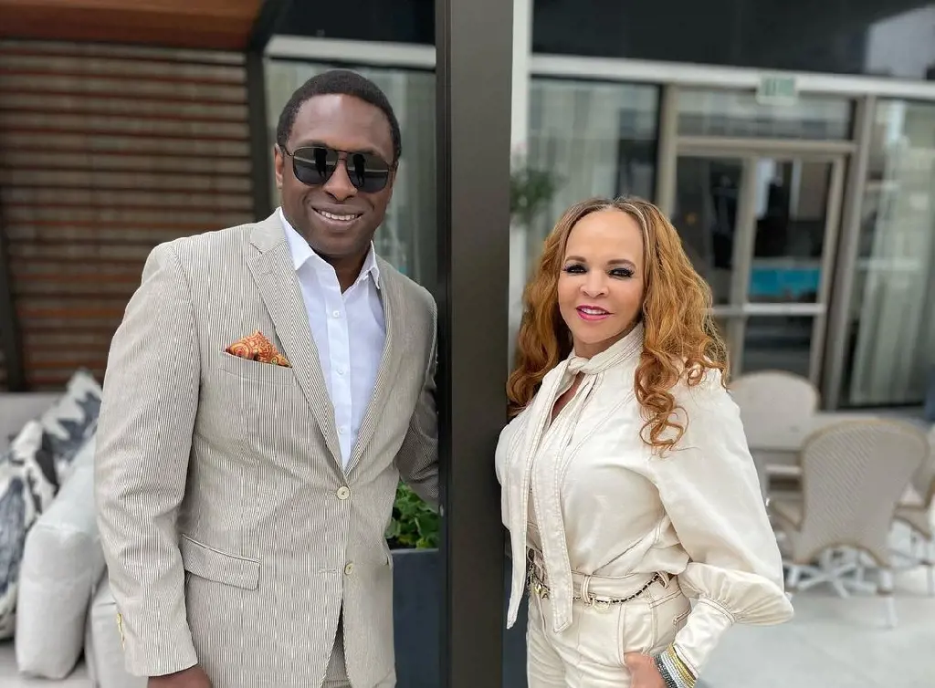 Avery and Cassandra, both looking elegant, celebrating their 31st anniversary in July 2022