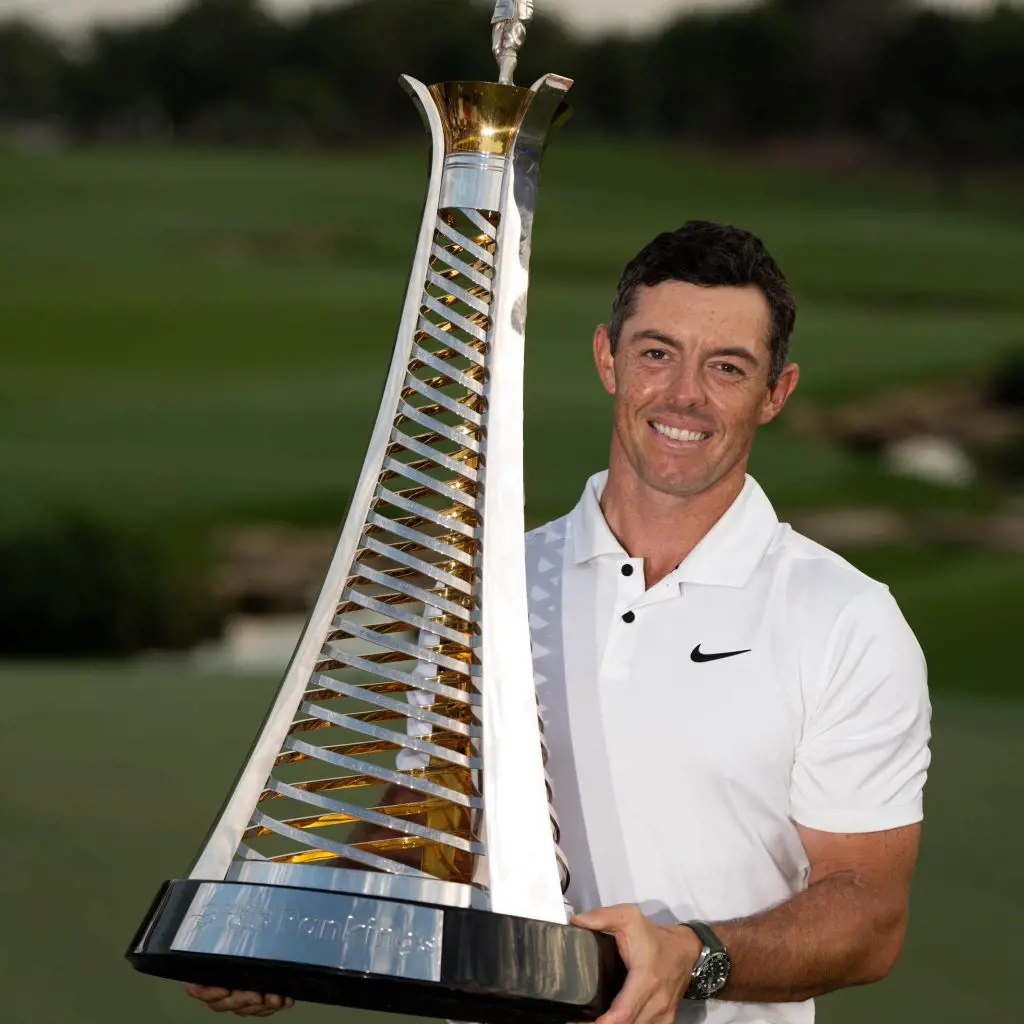 McIlroy lifting the DP World Tour Championship after defeating Jon Rahm in 2022