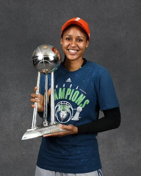 Maya Moore holding the coveted championship trophy.