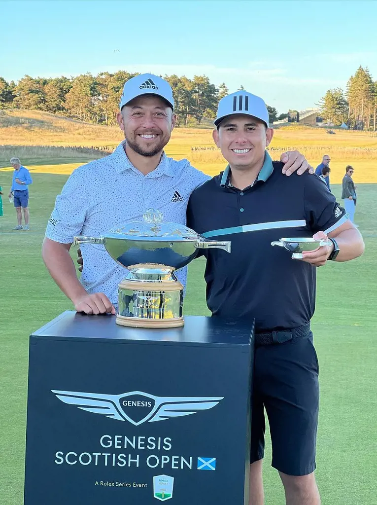 Xander Schauffele with his caddie Austin Kaiser after the win in 2022