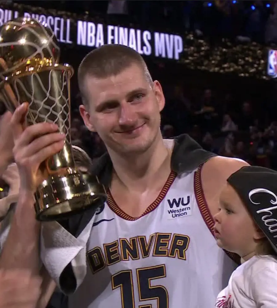 Jokic celebrating the Most Valuable Player award with his daughter, Ognjena.