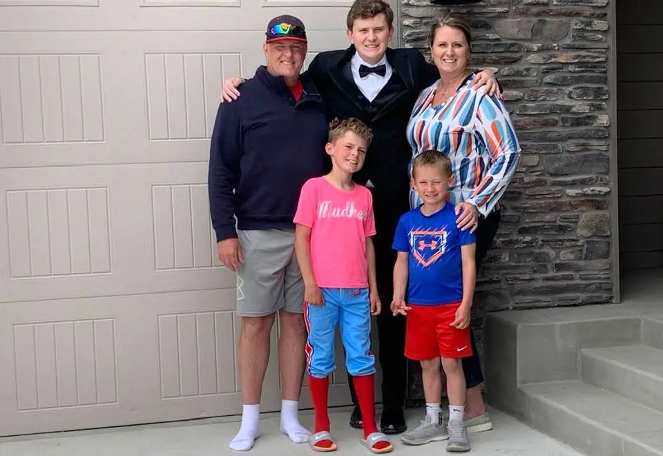Heidi takes picture with Heath, Michael, Ethan, and Alex outside their home in May 2021