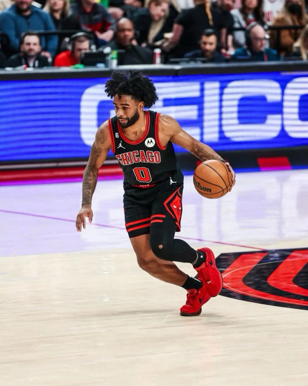 Coby White in the Bull's jersey playing in the NBA game to make the playoffs