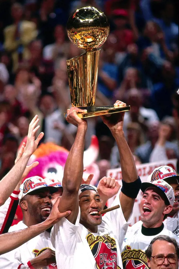 The Bulls lifting the 1998 championship trophy at the United Center in Chicago, Illinois.