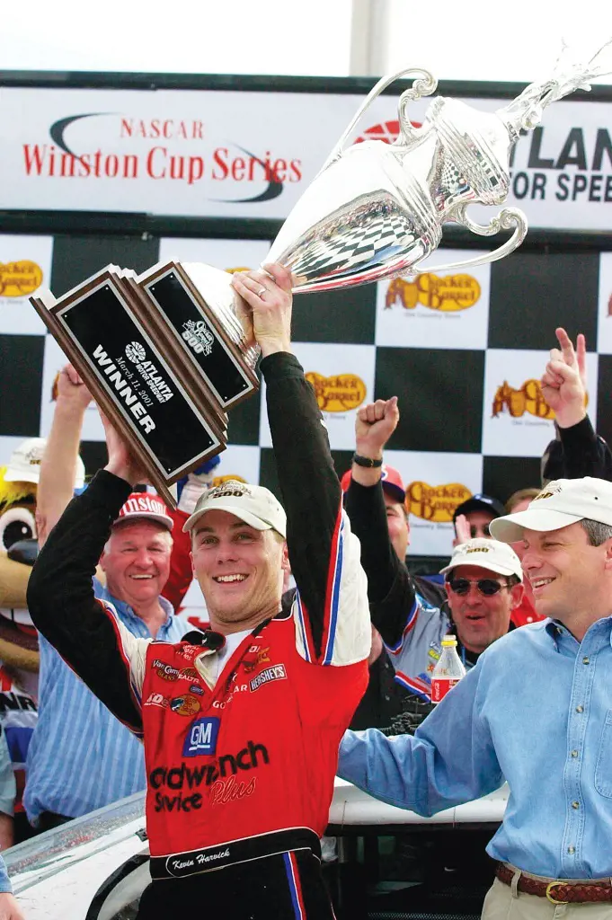 Kevin Harvick lifts the trophy after winning NASCAR Cup Series at Atlanta Speedway.