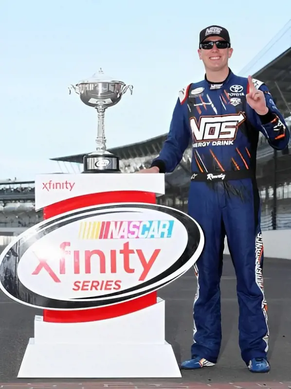 Kyle Busch stands beside his trophy after 2017 victory at Atlanta.