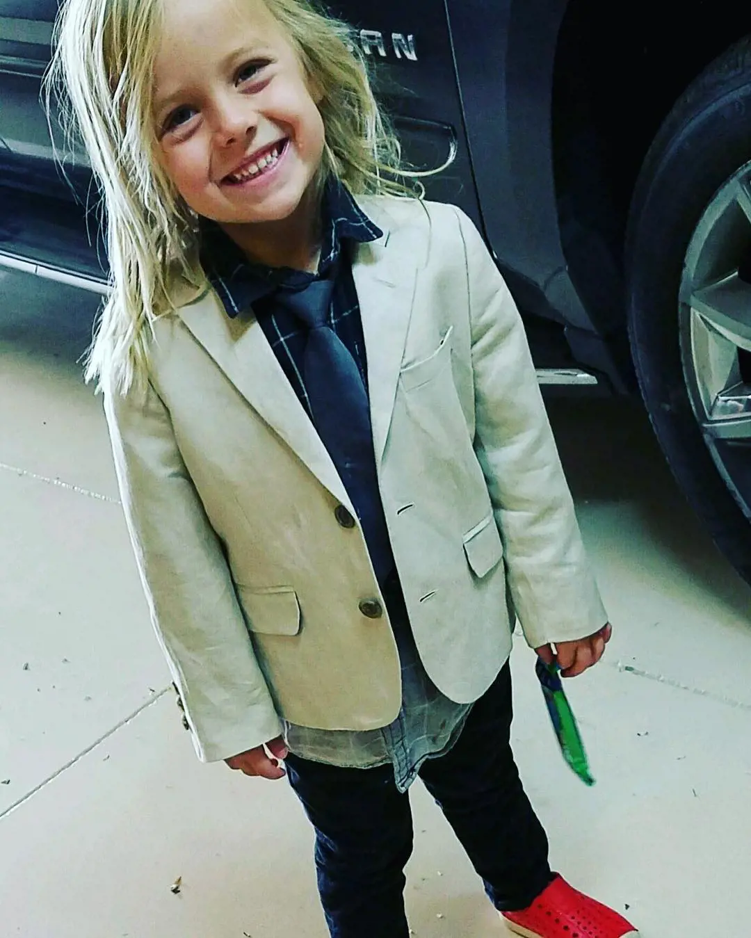 Jeremiah looking cool with his dress up as he head up on his way to church. 