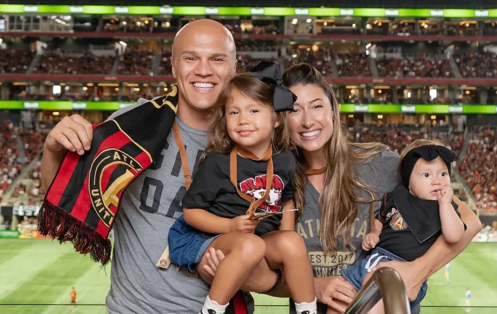 Coy and Claire supporting Atlanta United in a sporting event with Wrenn and Ruby in June 2021