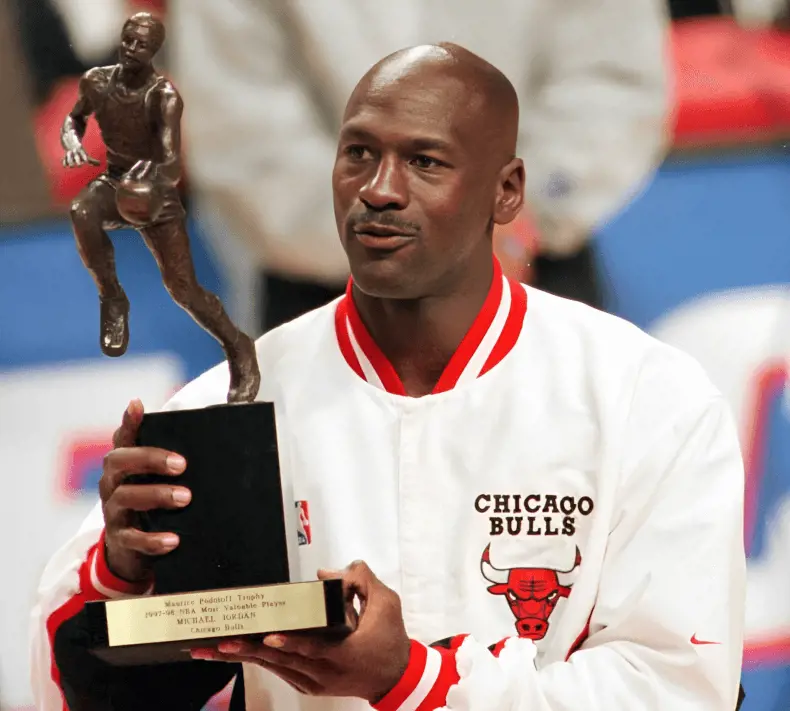 Jordan with the 1997-98 MVP award (AP Photo/Frank Polich)
